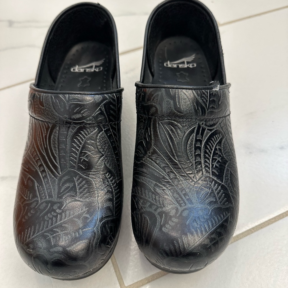 Leather Dansko clogs.